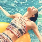 Girl cooling down in a swimming pool
