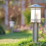 Outdoor lamp on yard lawn for garden lighting in summer park